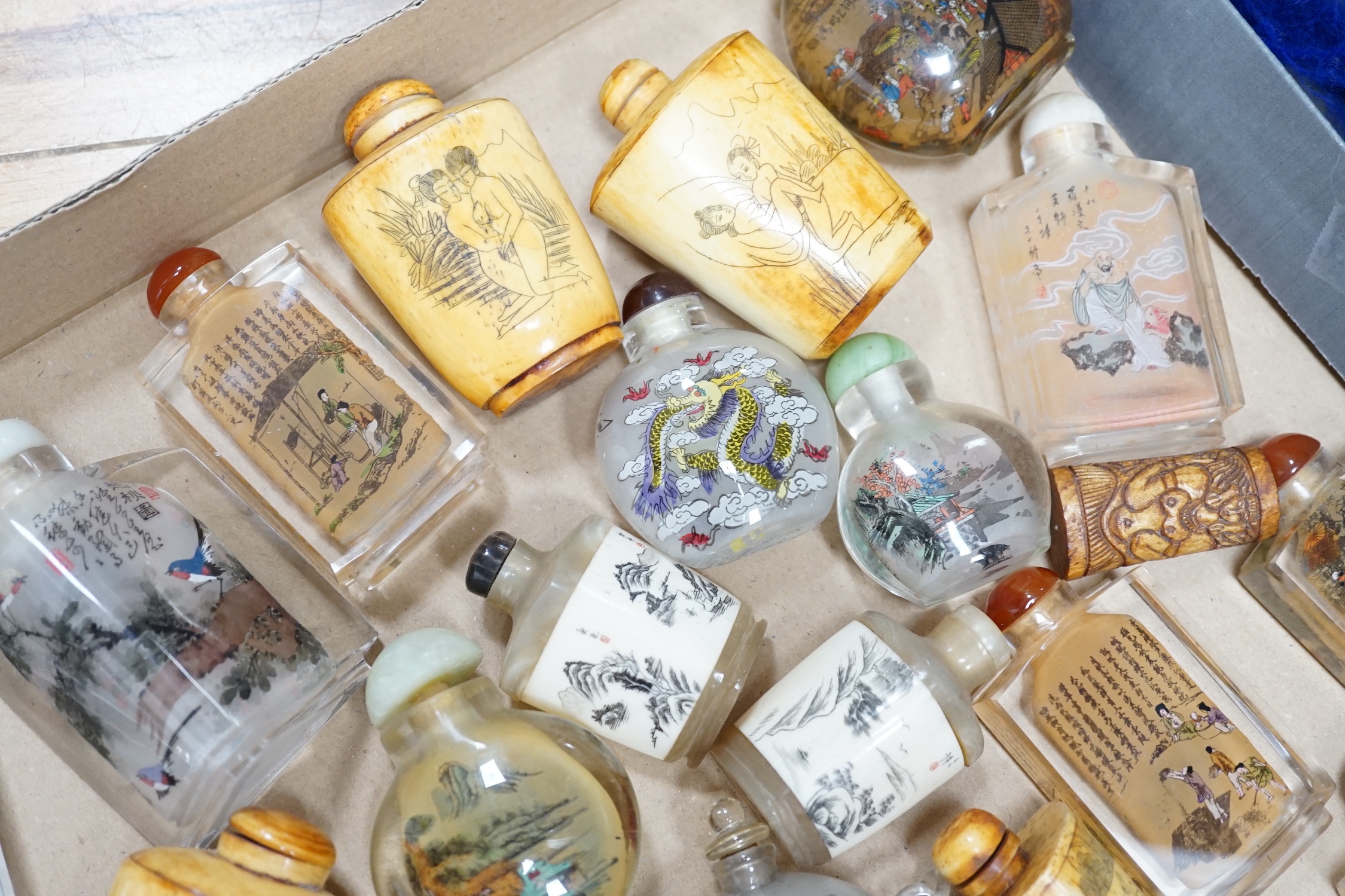 A collection of Chinese snuff bottles, mostly reverse painted (2 trays)